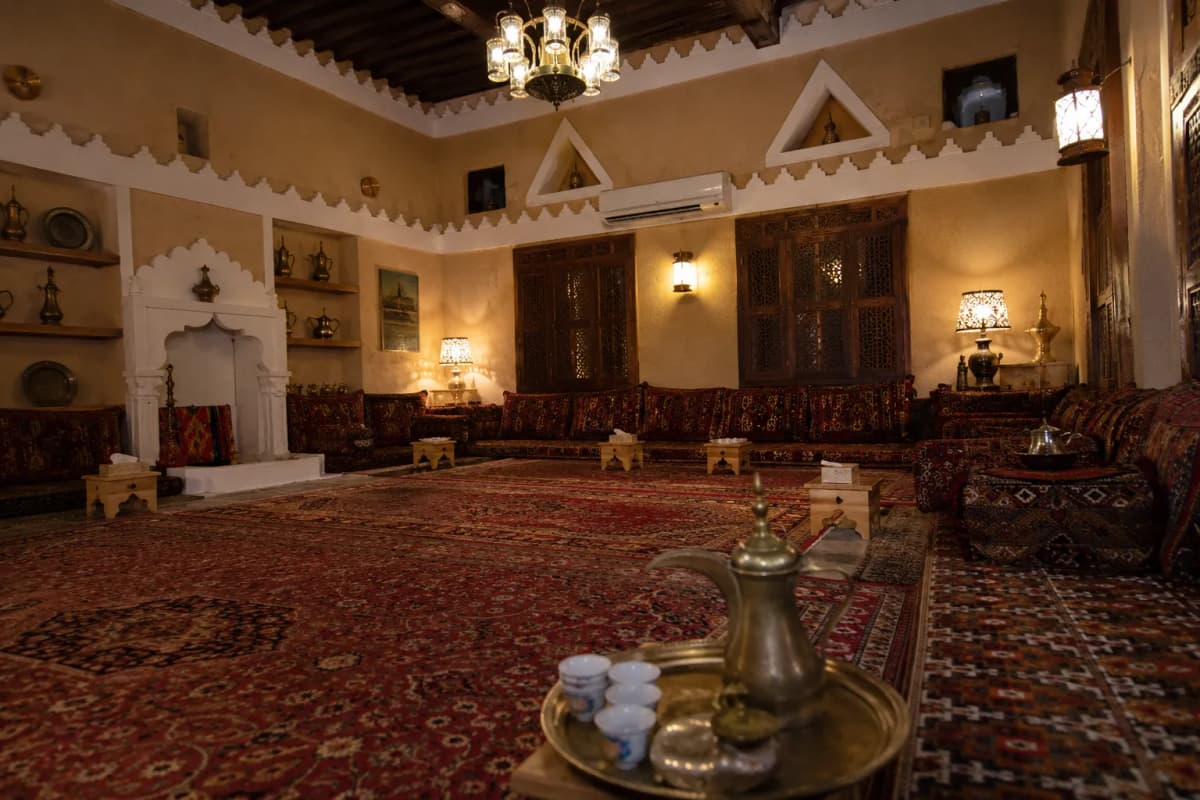 Traditional Saudi Arabian majlis with cushions and Arabic coffee